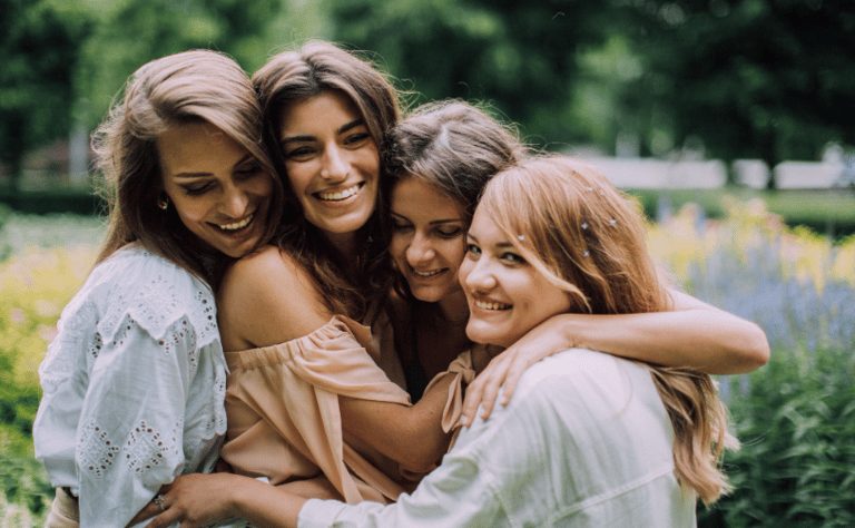 A group of women embracing and laughing